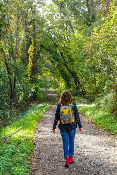 istock woman walking on the path. 1223288046