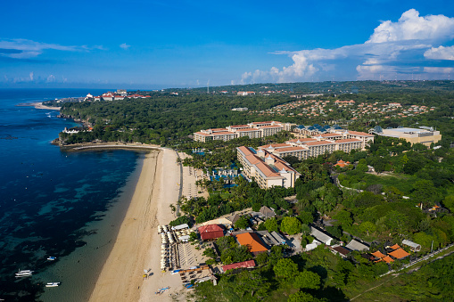 Aerial view taken by drone of the famous luxury Mulia resort facing the sea in Nusa Dua in Bali Indonesia.