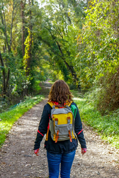 istock woman walking on the path. 1223288744