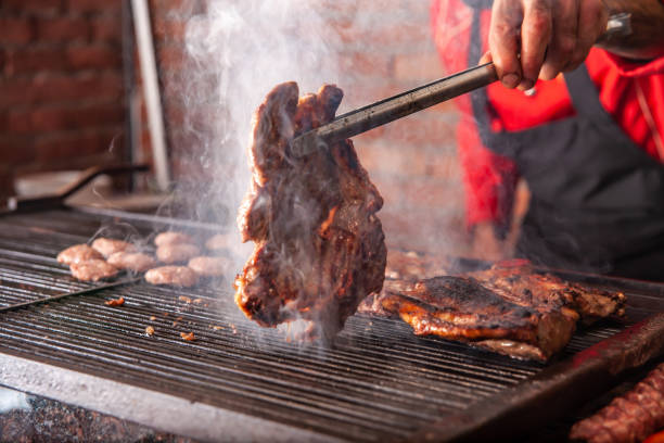 istock chef cooking meat on the grill 1223295315