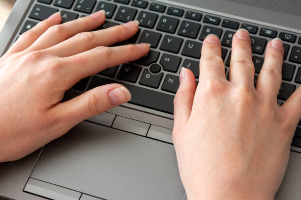 istock Woman working at home office hands on keyboard close up 1223298728