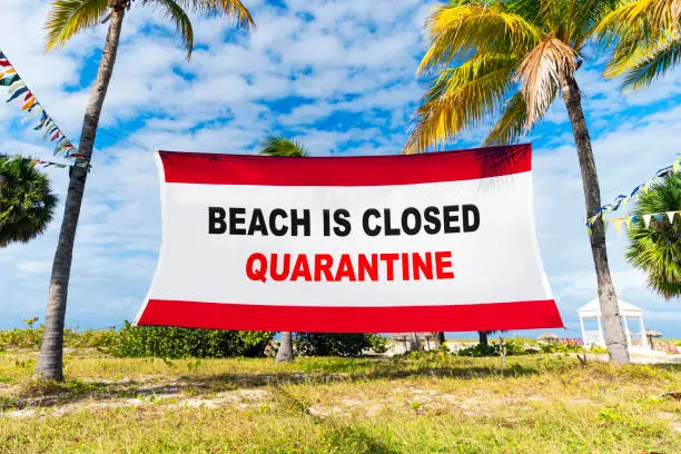 Photo of Due to the Corona Virus Covid-19 pandemic, beaches are closed. Beach holidays are forbidden. Epidemic among tourists. entrance to the sea is closed. You can't swim or sunbathe.