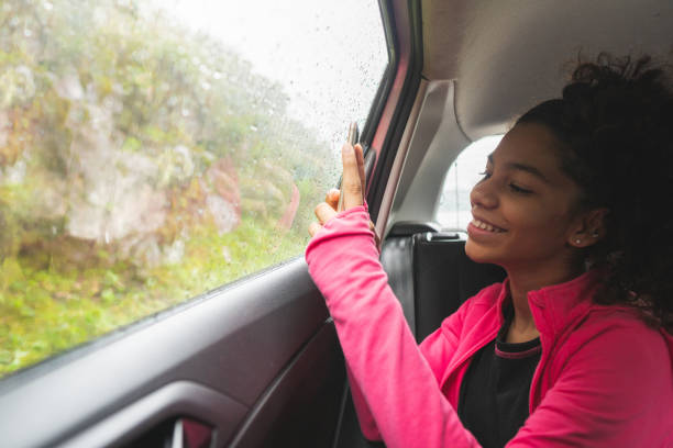 istock Teenager taking selfie inside the car 1223308244