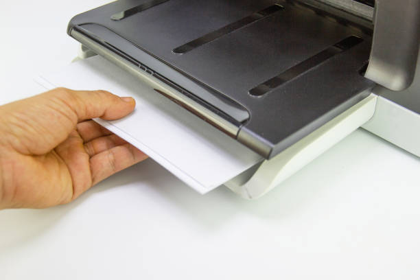 istock hand man lay down the paper from printer in the office, Business concept 1223309250