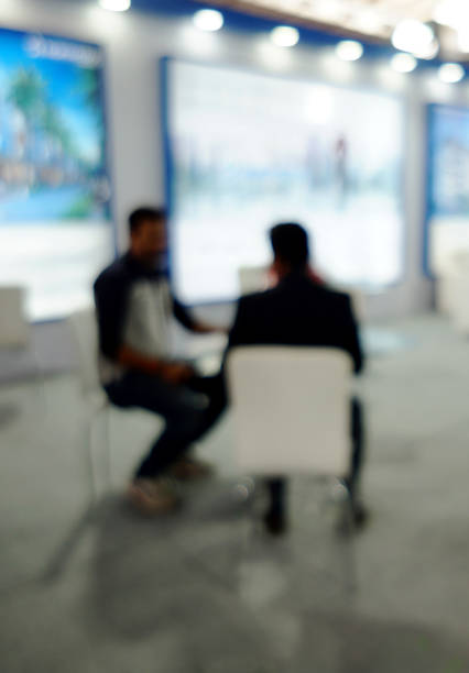 istock blurred image of people at trade show 1223313873