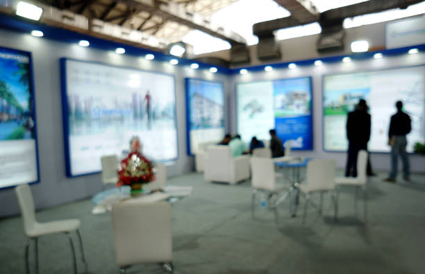 blurred image of people at trade show stock photo