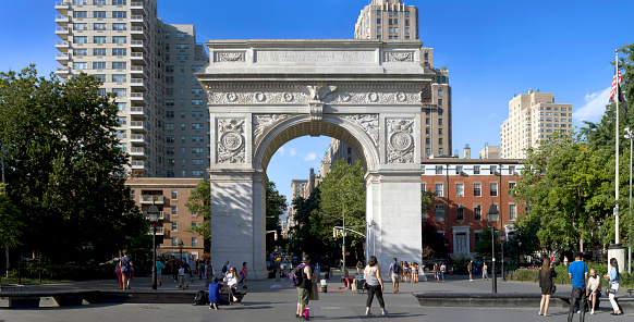 New York, New York/USA - June 29, 2018: People visit Washington Square park near the Arc and fountain.
