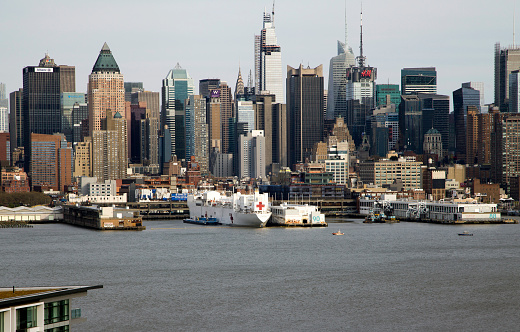 New York, New York/USA - April 25, 2020: Navy hospital ship Comfort docked at Pier 90 to assist during the Coronavirus outbreak in the city.