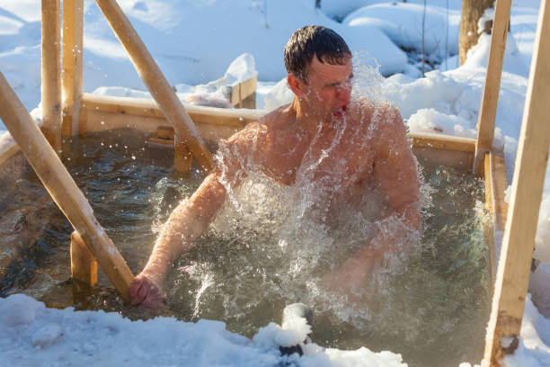istock Young man haves bath in the icy water 1223317060