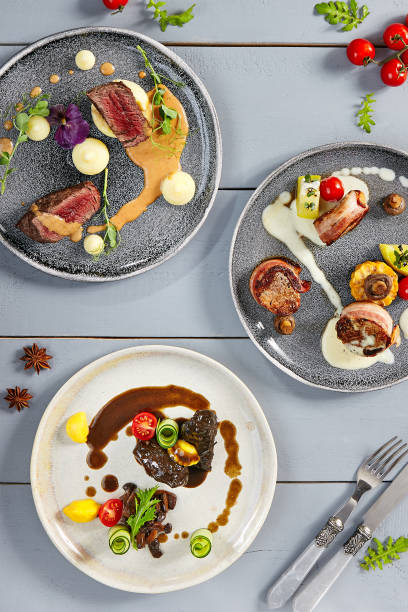 istock Hot meals, meat appetizers in ceramic plates top view 1223317731