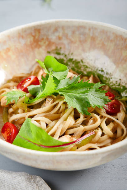 istock Asian noodles with chicken in beige bowl 1223317737