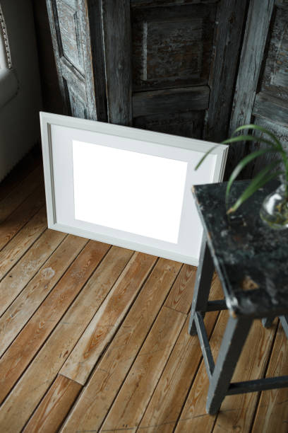 istock White isolated posters with frame mockup in in wall 1223318838