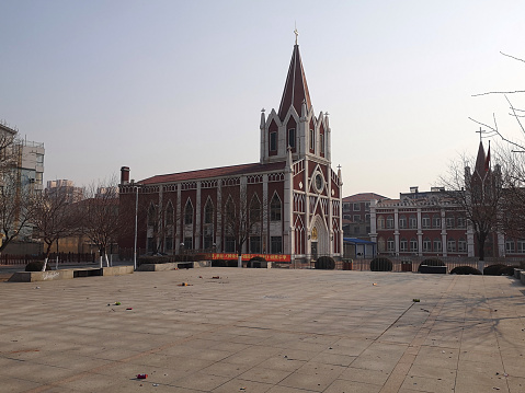Empty town square by the church diocese of Yingkou city, Liaoning, China.