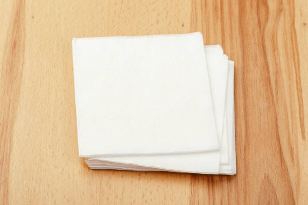 istock white paper napkin or tissue on the wooden table background. 1223323015