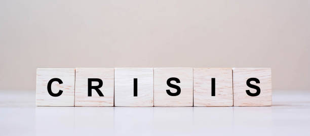 istock wooden cube blocks with CRISIS text on table background. Coronavirus pandemic, risk, fall Business, unemployment, Economic recession and Bankrupt concept 1223324557