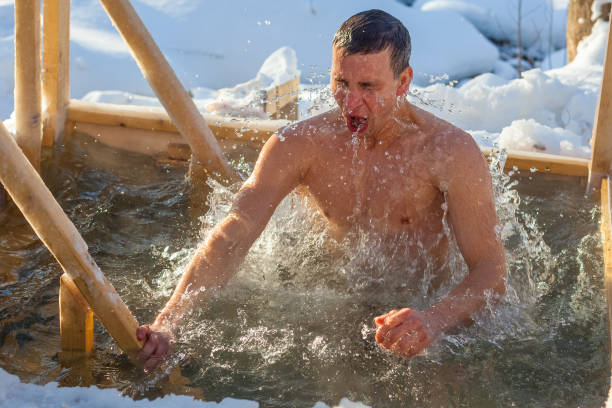 istock Young man haves bath in the icy water 1223327246