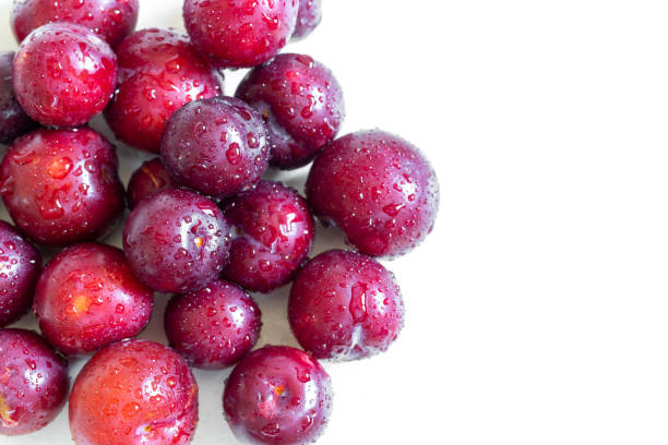 istock Ripe juicy plums on white background 1223327520