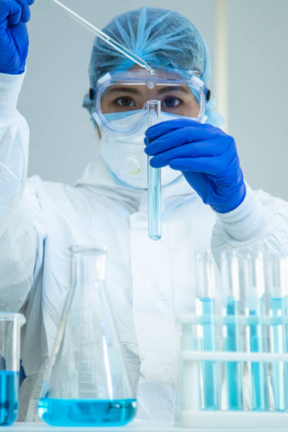 istock Scientist in laboratory with test tubes 1223331819
