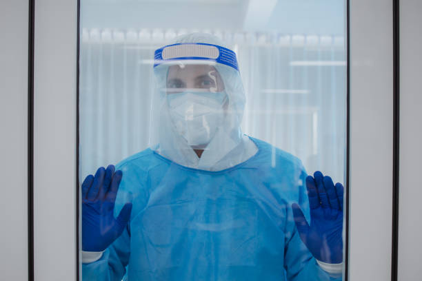 istock Doctor in protective mask acting hopeless 1223331944