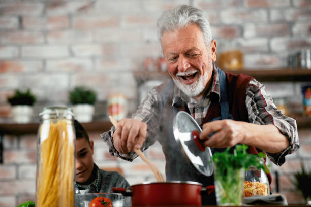 istock Senior man cooking delicious food in kitchen. 1223334831