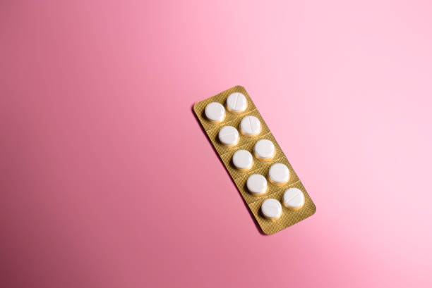 istock one blister pack of white pills with pink background 1223339387