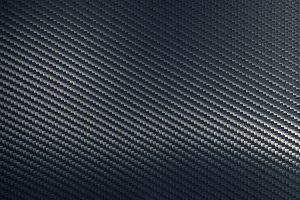 istock Bended surface of grey woven carbon fibre composite sheet. 1223340251
