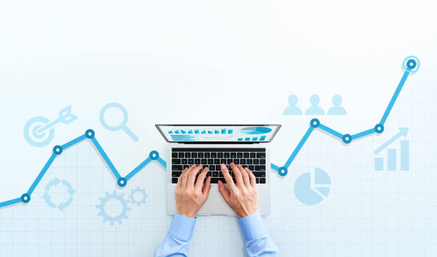 Web analytics and digital marketing. Top view of business man using laptop.