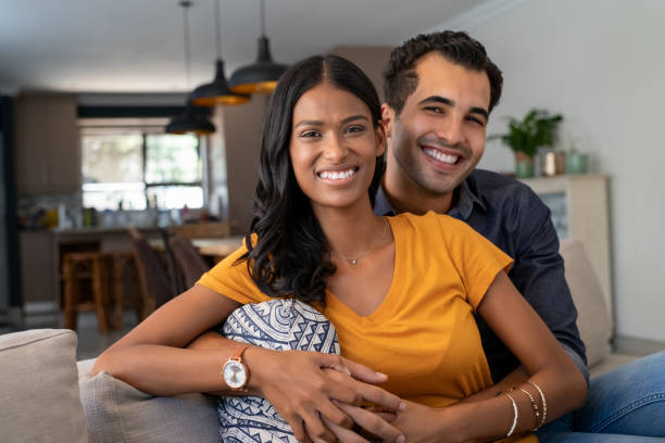 istock Young indian couple embracing at home 1223342018