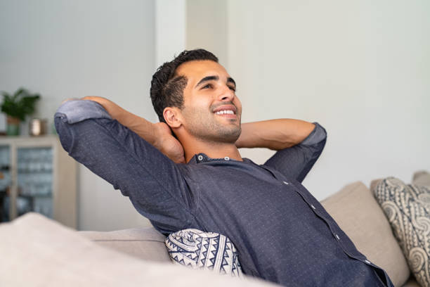istock Young indian man relaxing at home 1223342989