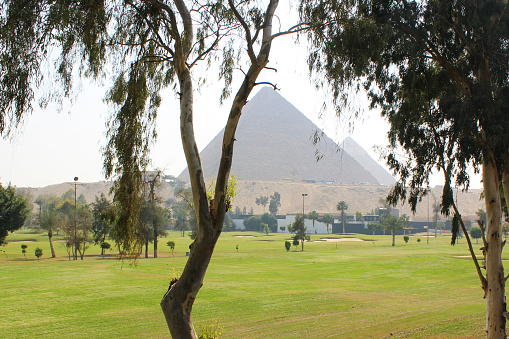 Golf course in Cairo and the Great Egyptian Pyramids at Giza.