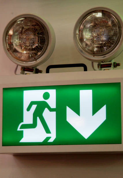 Close-up view of Fire alarm exit sign with electric bulbs view of Fire alarm exit sign with electric bulbs inside of flash stock pictures, royalty-free photos & images