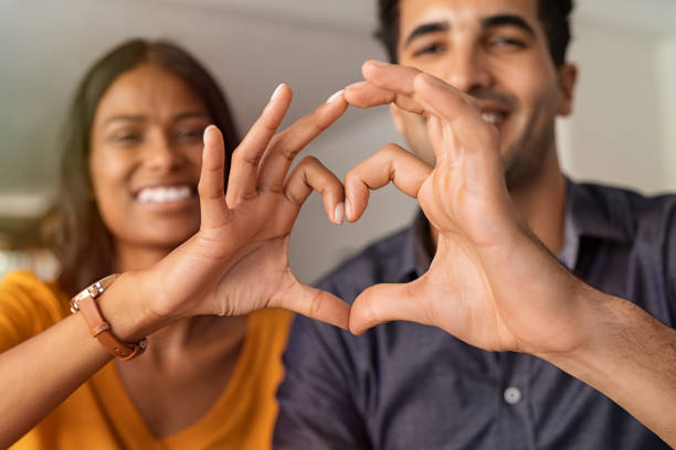 istock Indian couple making heart with hands 1223344420