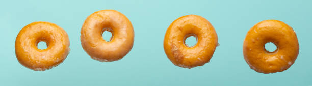 istock Falling donuts in a glaze on a blue background 1223344628
