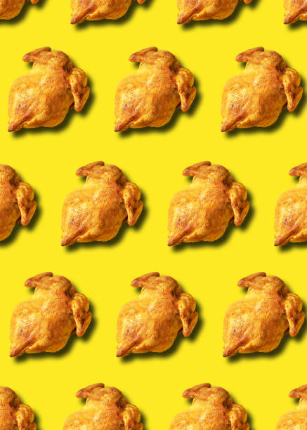 istock Colorful pattern of roasted chicken or turkey on yellow background. Top view. Creative design for packaging. Food seamless pattern. Thanksgiving day concept. 1223344763