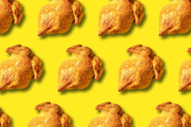 istock Colorful pattern of roasted chicken or turkey on yellow background. Top view. Creative design for packaging. Food seamless pattern. Thanksgiving day concept. 1223344764
