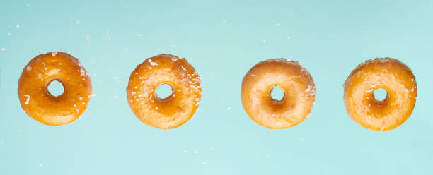istock Falling donuts in a glaze on a blue background 1223347286