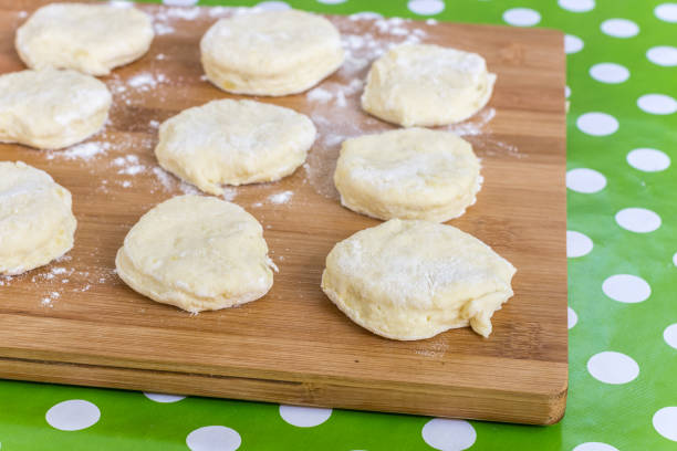 istock Homemade raw dough on the kitchen wooden board 1223347689