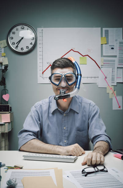 Office worker wearing scuba mask Smiling office worker wearing scuba mask with negative business chart on background. office cubicle mask stock pictures, royalty-free photos & images