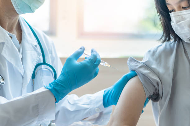 istock Immunization and vaccination for flu shot, influenza, HPV or Covid-19 prevention with young child girl having vaccine injection for World immunization week and International HPV awareness day 1223349775