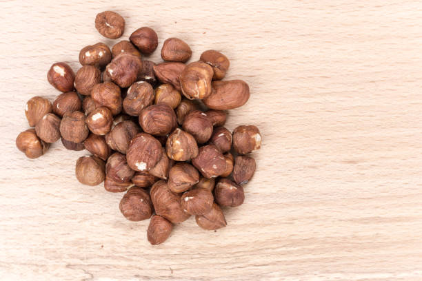 istock Bunch of hazelnut on the cutting board 1223350107