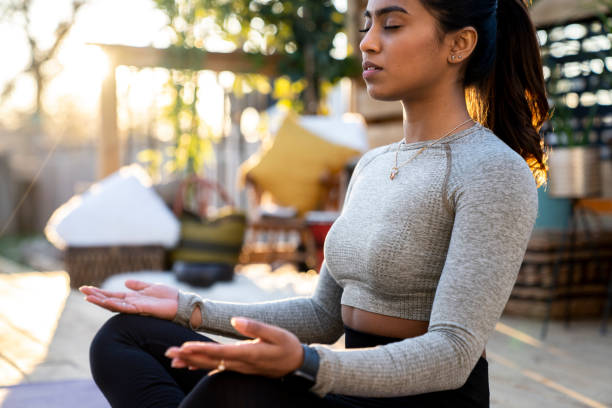 istock Beautiful Middle Eastern Female Doing Yoga in Backyard 1223350480