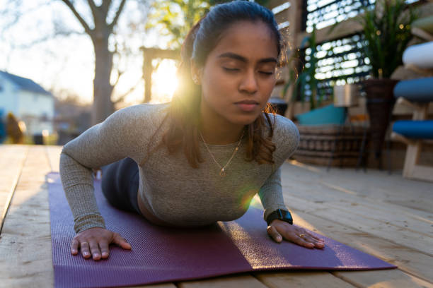 istock Beautiful Middle Eastern Female Doing Yoga in Backyard 1223350481