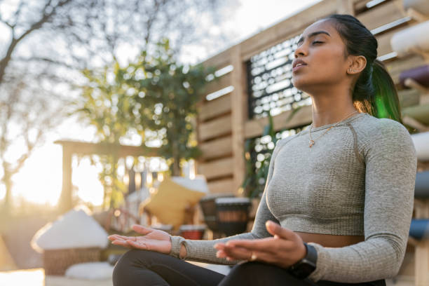 istock Beautiful Middle Eastern Female Doing Yoga in Backyard 1223350497