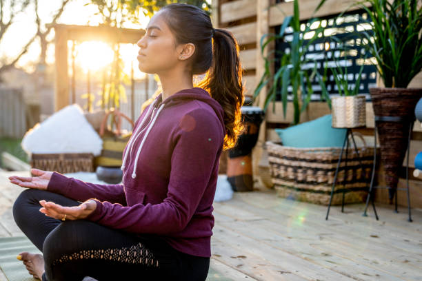 istock Beautiful Middle Eastern Female Doing Yoga in Backyard 1223350517