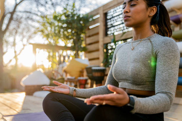 istock Beautiful Middle Eastern Female Doing Yoga in Backyard 1223350530