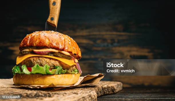 Close Up Tasty Beef Burger Stock Photo - Download Image Now - Cheeseburger, Burger, Kitchen Knife