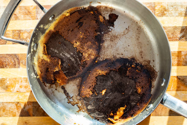 istock steel stewpan with remains of burned while cooking 1223356259