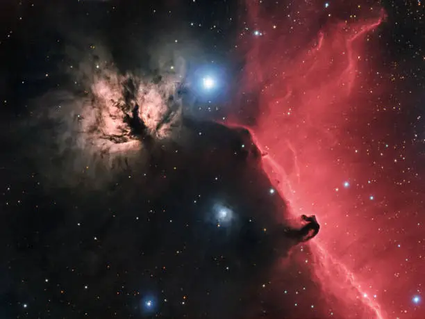 The Flame Nebula (NGC 2024) and Horsehead Nebula  (B33 against IC 434) are beautiful emission and dark nebulas located near Alnitak, the easternmost star of Orion's Belt. Nebulas are 900-1500 light years away from Earth. Picture taken with professional CCD camera and refractor telescope (800mm, f/6.95) ha-alpha wavelength mixed with RGB (HaRGB image). Total exposure time 18h.