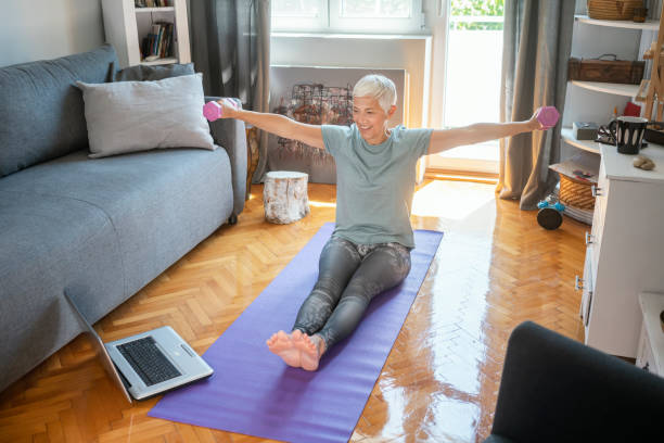 istock Mature woman exercise at home 1223358615