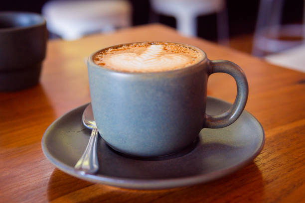 istock Cup of coffee on a wooden table. Hot cappuccino 1223359721